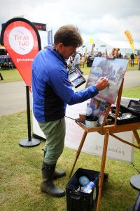 Tom Cringle painting Norfolk Showground at RNS17. Photo by KJW