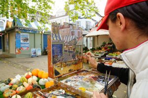 Artist Emily Faludy painting the Market, Paint Out Norwich 2017. Photo © Katy Jon Went