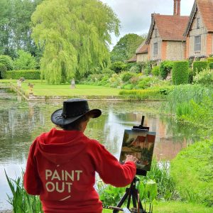 Artist Eleanor Alison painting plein air at Paint Out Elsing Hall Gardens, Norfolk